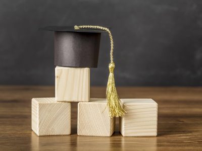 bunch-wooden-cubes-with-graduation-cap (1)