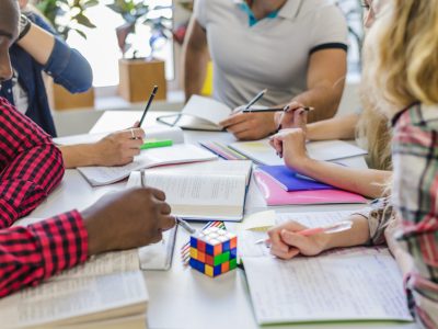 crop-people-with-textbooks-table