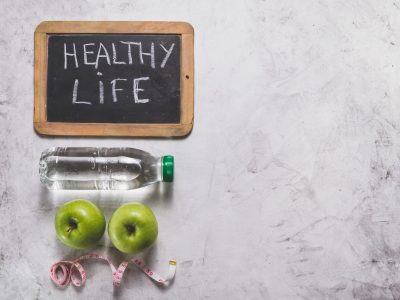 healthy-life-composition-with-apples-slate-water-bottle