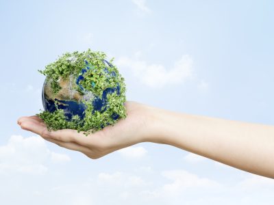 Sustainable living environmentalist hand holding green earth