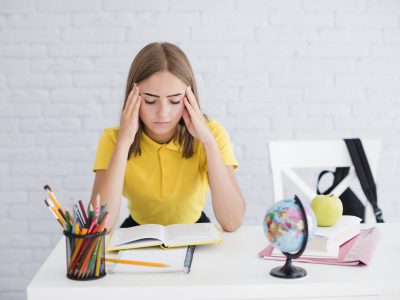 tired-teenager-holding-her-head